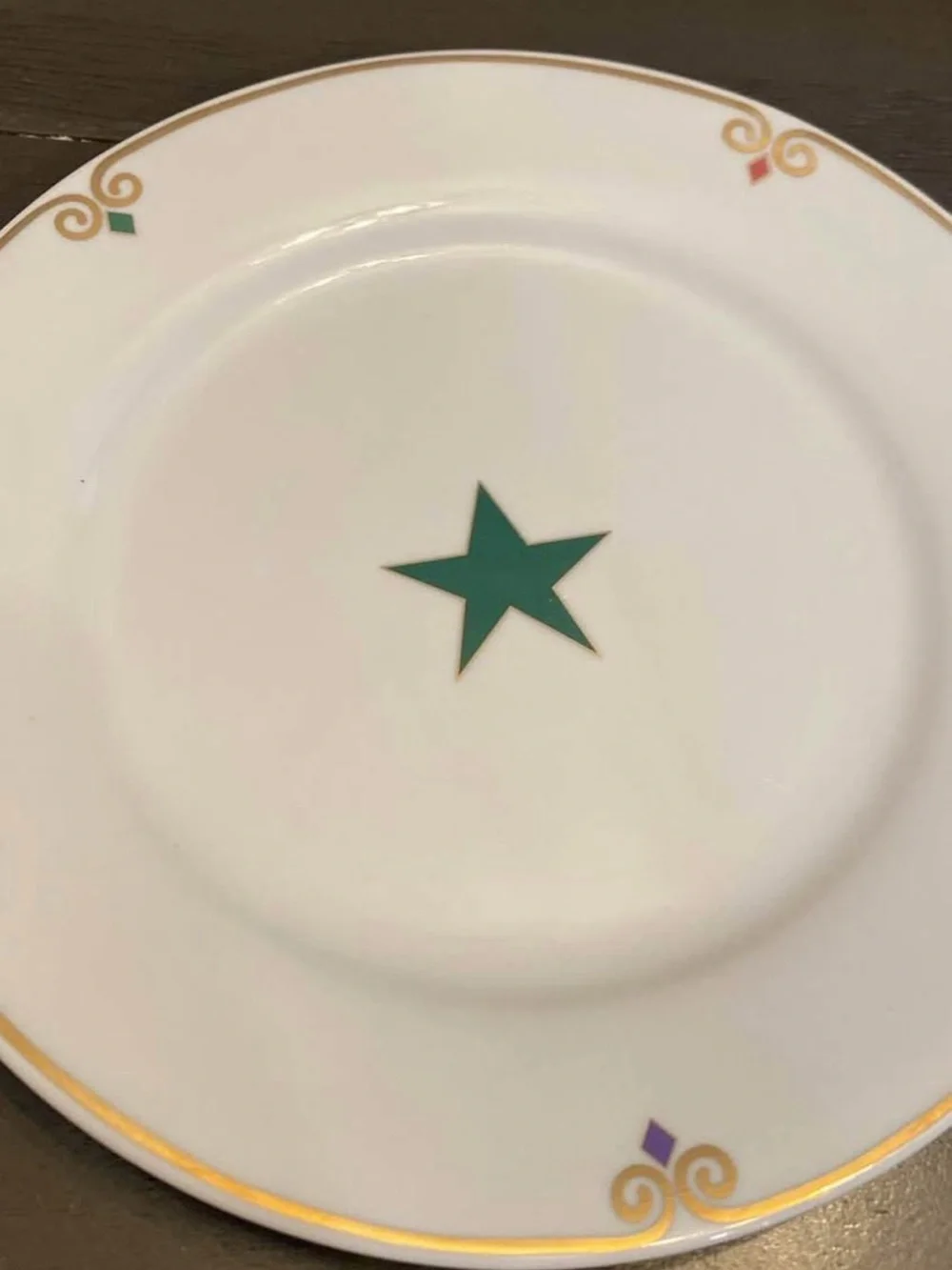 Pier 1 White  Plates with Multicolor Star Accents and Gold Trim